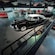 A 2 level gallery filled with an array of vintage and antique automobiles